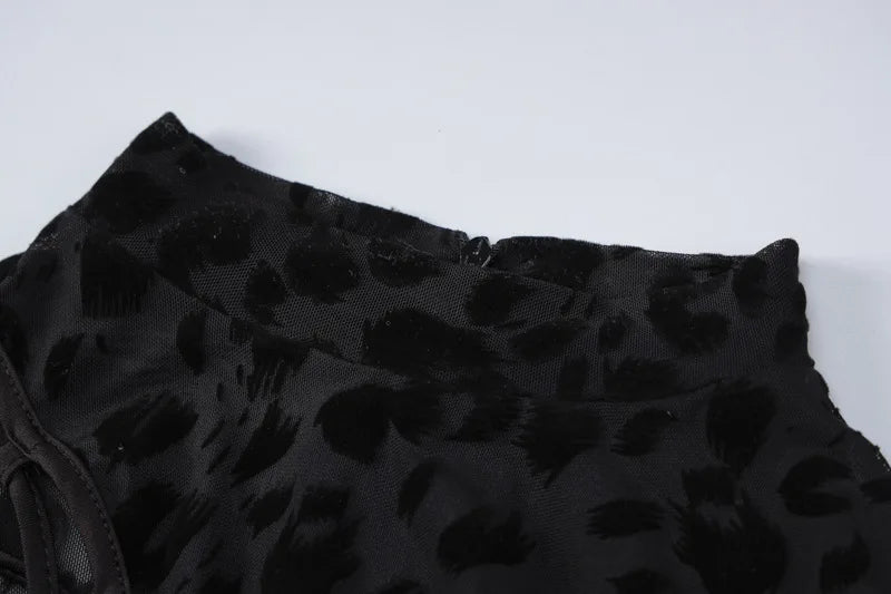 OMSJ 2024 mono ajustado asimétrico sexi de malla transparente con estampado de leopardo para invierno nuevo mono calado de manga larga ajustado entrecruzado