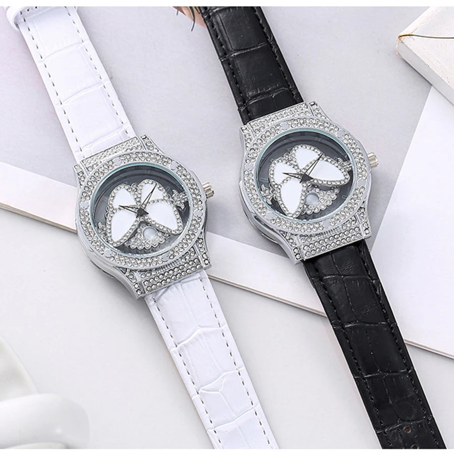 Reloj de cuarzo de cuero con diamantes de imitación de cristal brillante y mariposa giratoria para mujer a la moda