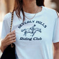 Beverly Hills Riding Club-camisetas con estampado blanco Retro americano para mujer, camisetas informales holgadas de manga corta, camisetas nuevas Ins Fashion 2025