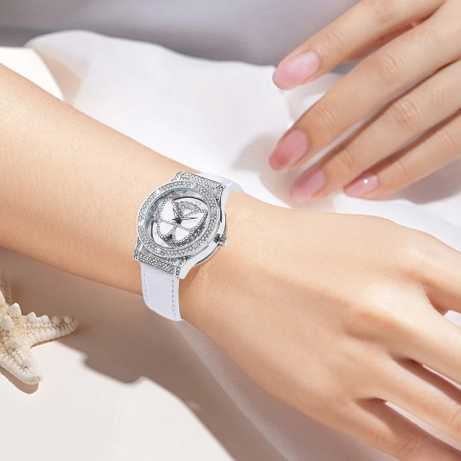 Reloj de cuarzo de cuero con diamantes de imitación de cristal brillante y mariposa giratoria para mujer a la moda