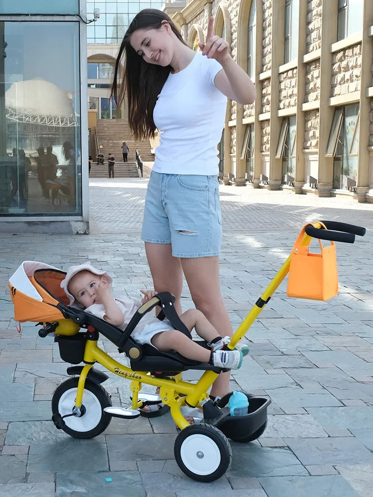 El triciclo se puede plegar, reclinar y sentarse, y la bicicleta se puede empujar a mano