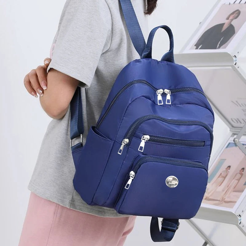 Bolso de doble hombro de nailon de estilo neutro para hombres y mujeres, adecuado para viajes de negocios, varios colores disponibles.